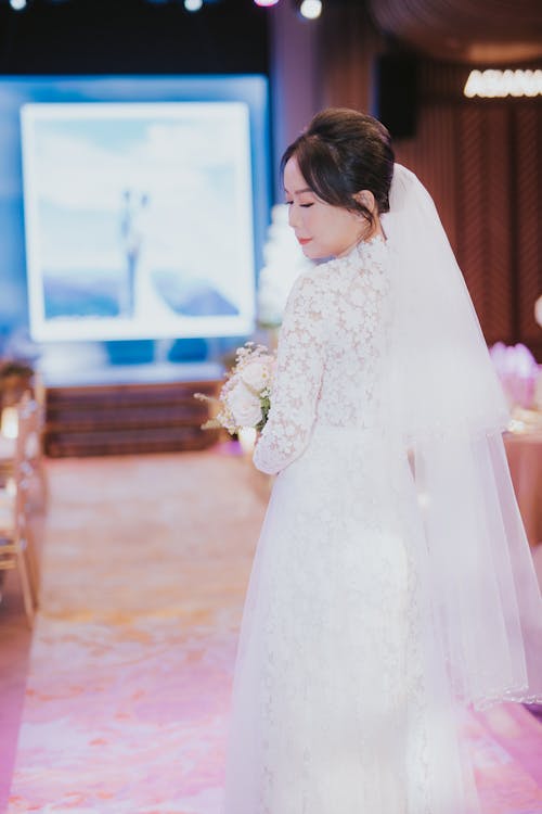 A Beautiful Bride in White Wedding Gown 