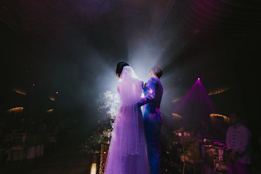 Bride and groom embrace in a romantic wedding dance in Ho Chi Minh City, Vietnam.
