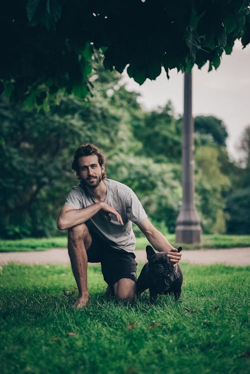 A Man with His Black Dog Pet