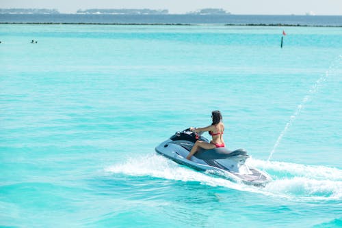 Woman Riding a Jetski