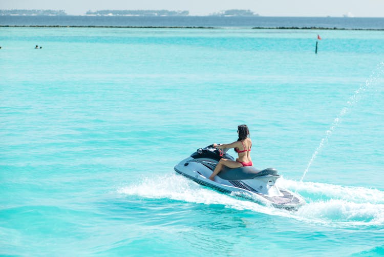 Woman Riding A Jetski