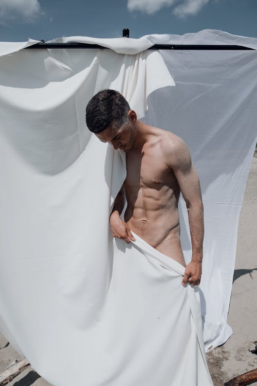 A Shirtless Man Doing Posing 