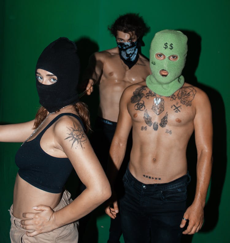 Shirtless Men And Woman Wearing Balaclavas 