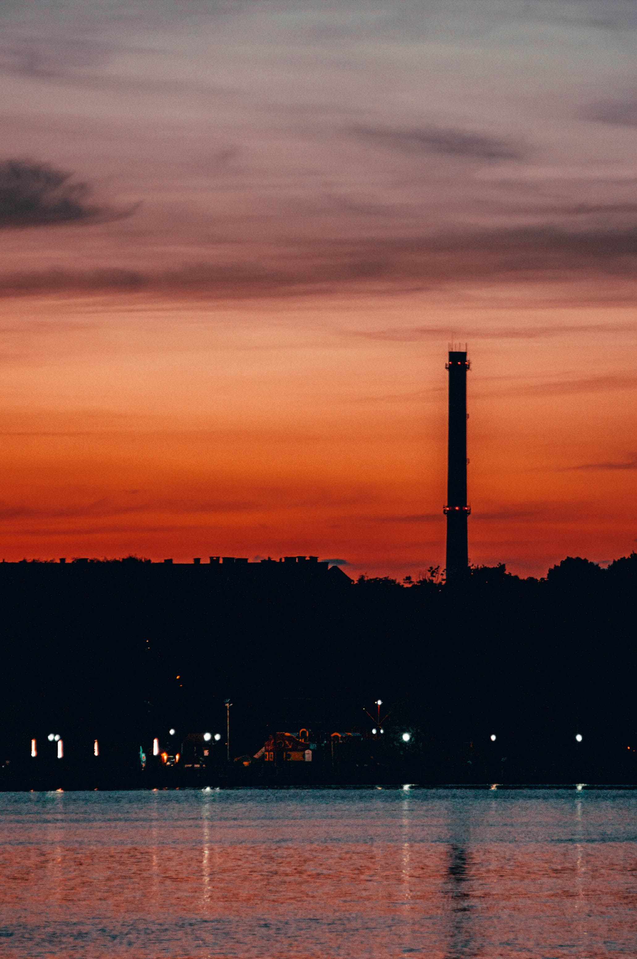 A Silhouette of a Tower during the Golden Hour · Free Stock Photo