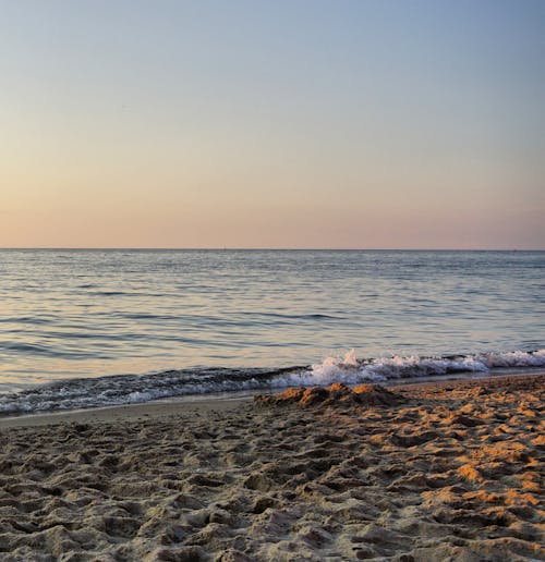 

Waves Crashing on a Shore with a Beautiful View of a Horizon