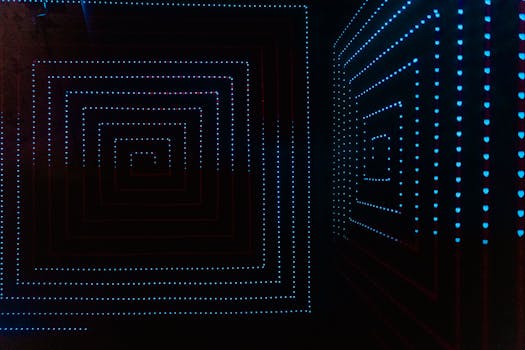 Abstract LED light pattern creating a geometrical illusion in a dark room setting.