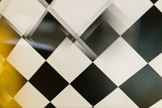 A creative black and white checkered pattern with a unique blurred effect adding artistic depth.