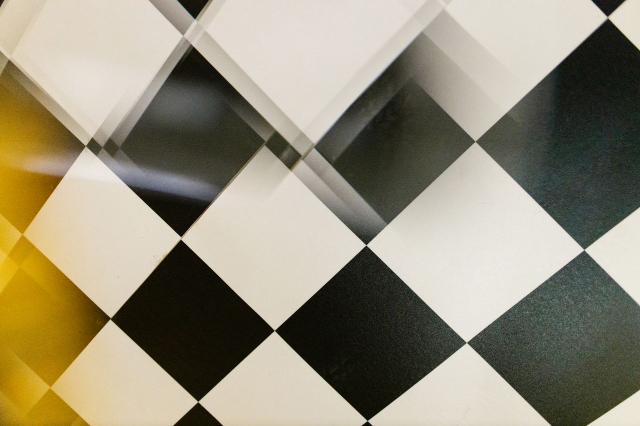 a creative black and white checkered pattern with a unique blurred eff