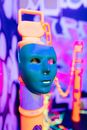 Blue and Yellow Mask With Purple and Pink Background