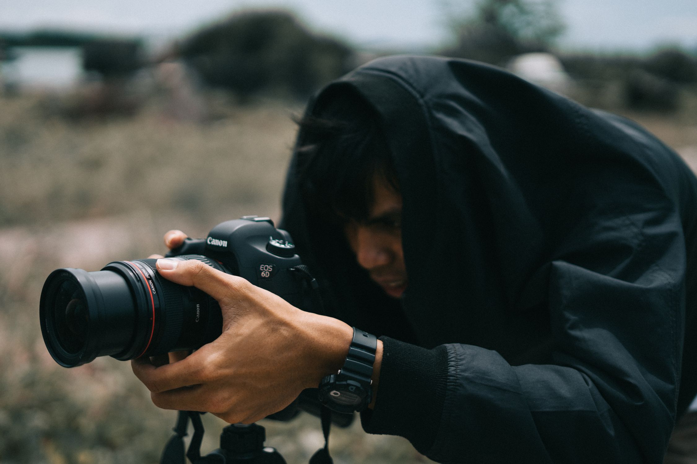 Black Canon Dslr Camera on Hand · Free Stock Photo