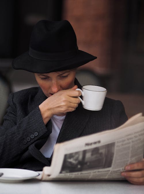 A Woman Reading a Newspaper 