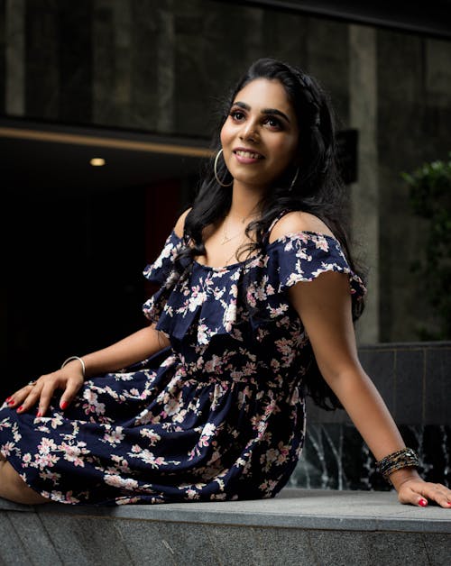 Smiling Woman in Floral Dress