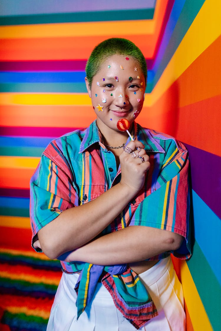 A Woman Holding A Lollipop