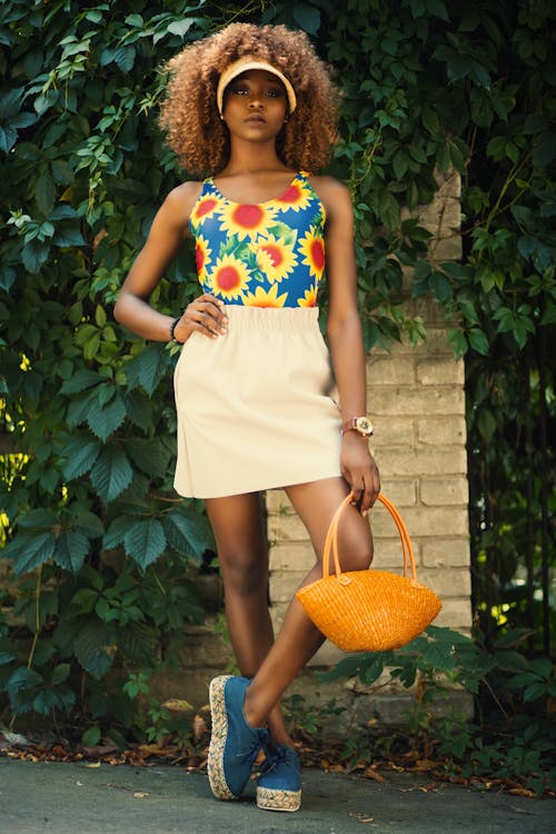 Woman Holding Orange Basket