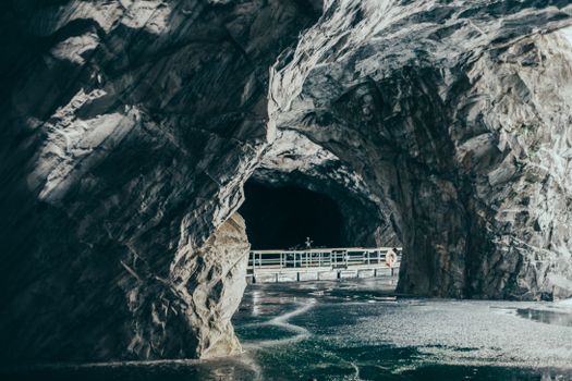 Explore the stunning marble cave with icy waters in Karelia, Russia, showcasing unique rock formations.