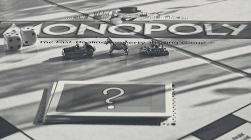 Monochrome Photo of Monopoly Items 