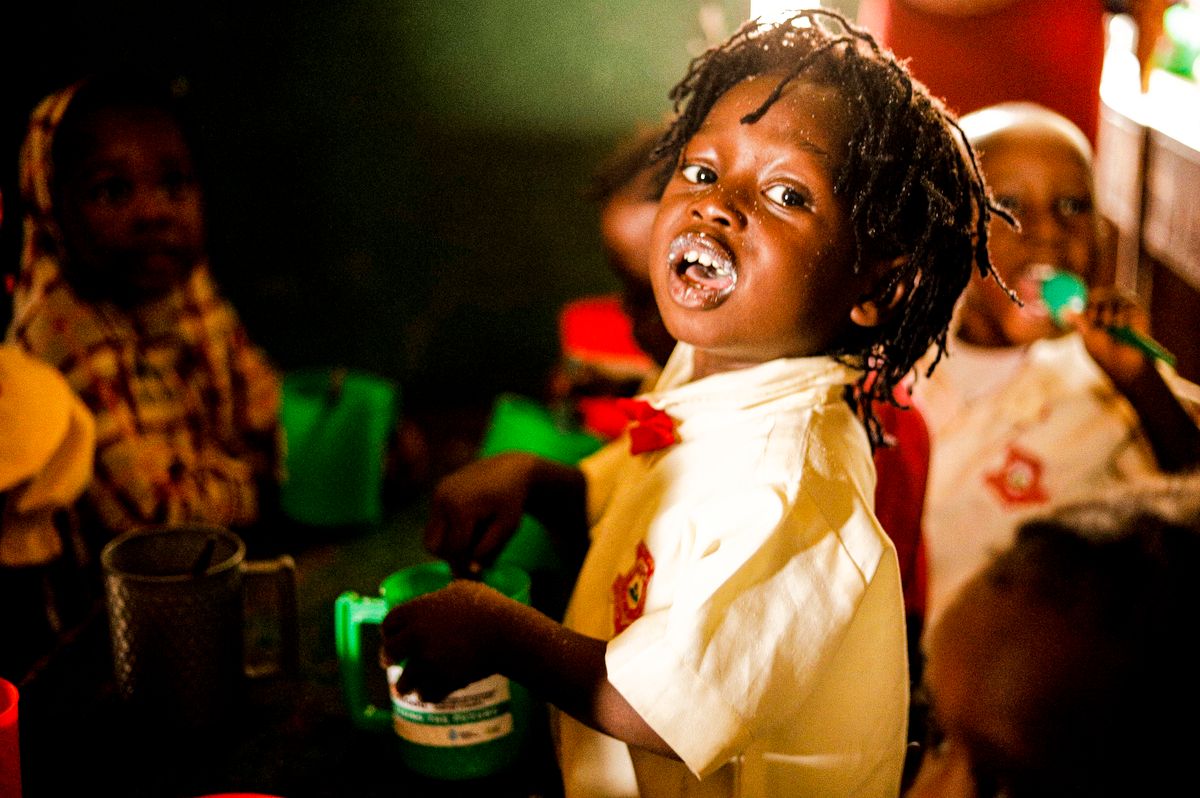 A group of children enjoying a meal together, sharing joy and community