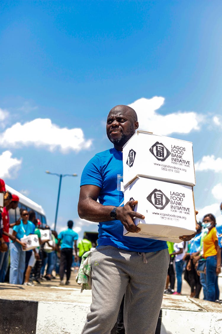 A Man Carrying Boxes