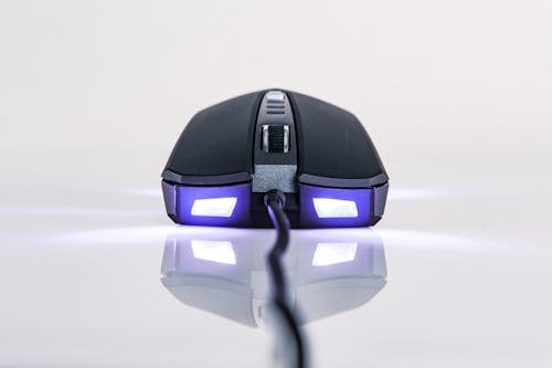 Close-Up Shot of a Computer Mouse on White Surface