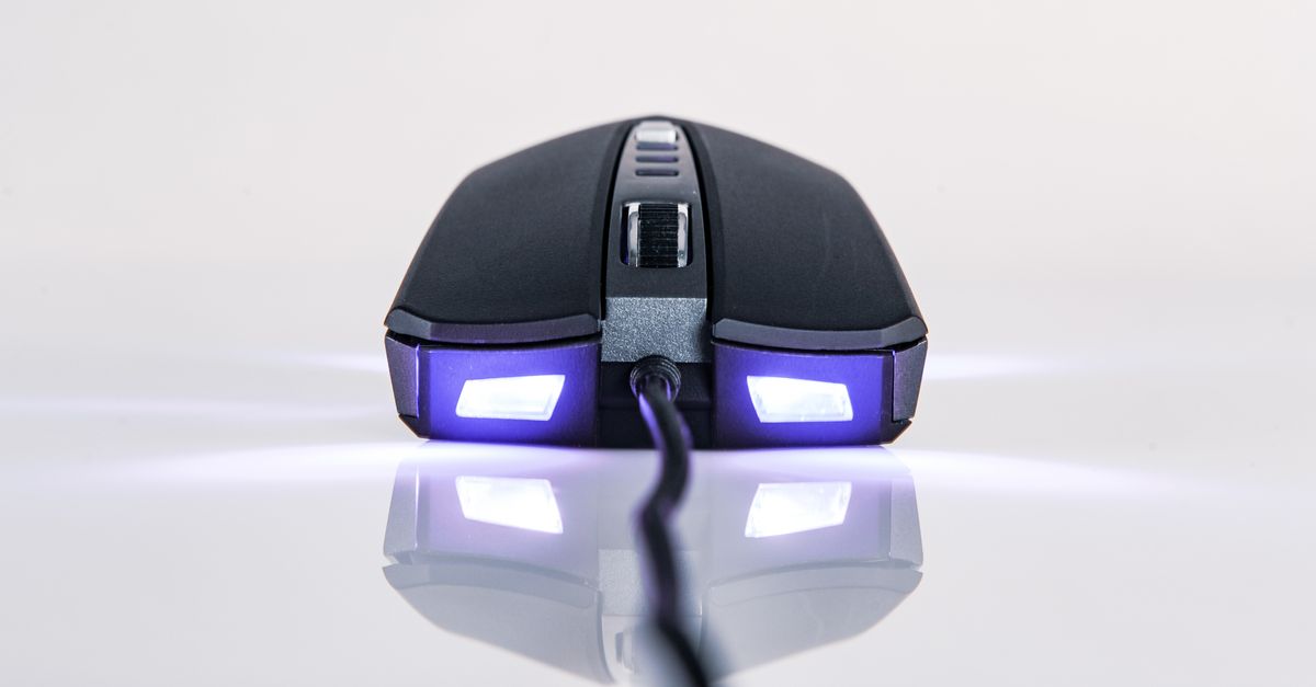 Close-Up Shot of a Computer Mouse on White Surface · Free Stock Photo