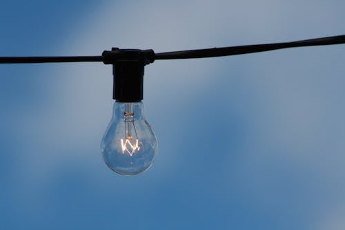 Free Clear Light Bulb on Wire Stock Photo