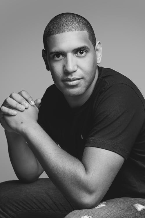 Grayscale Photo of a Man in Black Shirt