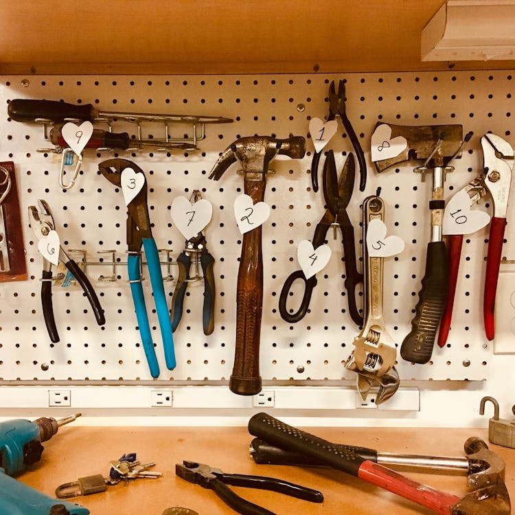 Free Handheld Tools Hang on Workbench Stock Photo