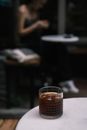 Clear Drinking Glass With Brown Liquid on Table