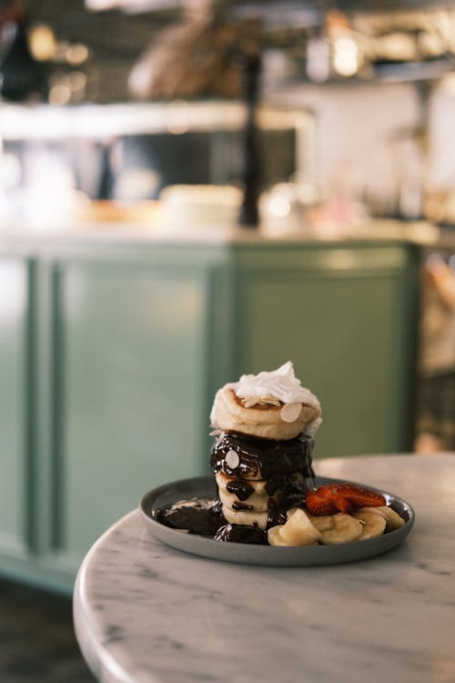 Free A Stack of Pancakes With Chocolate Syrup Stock Photo