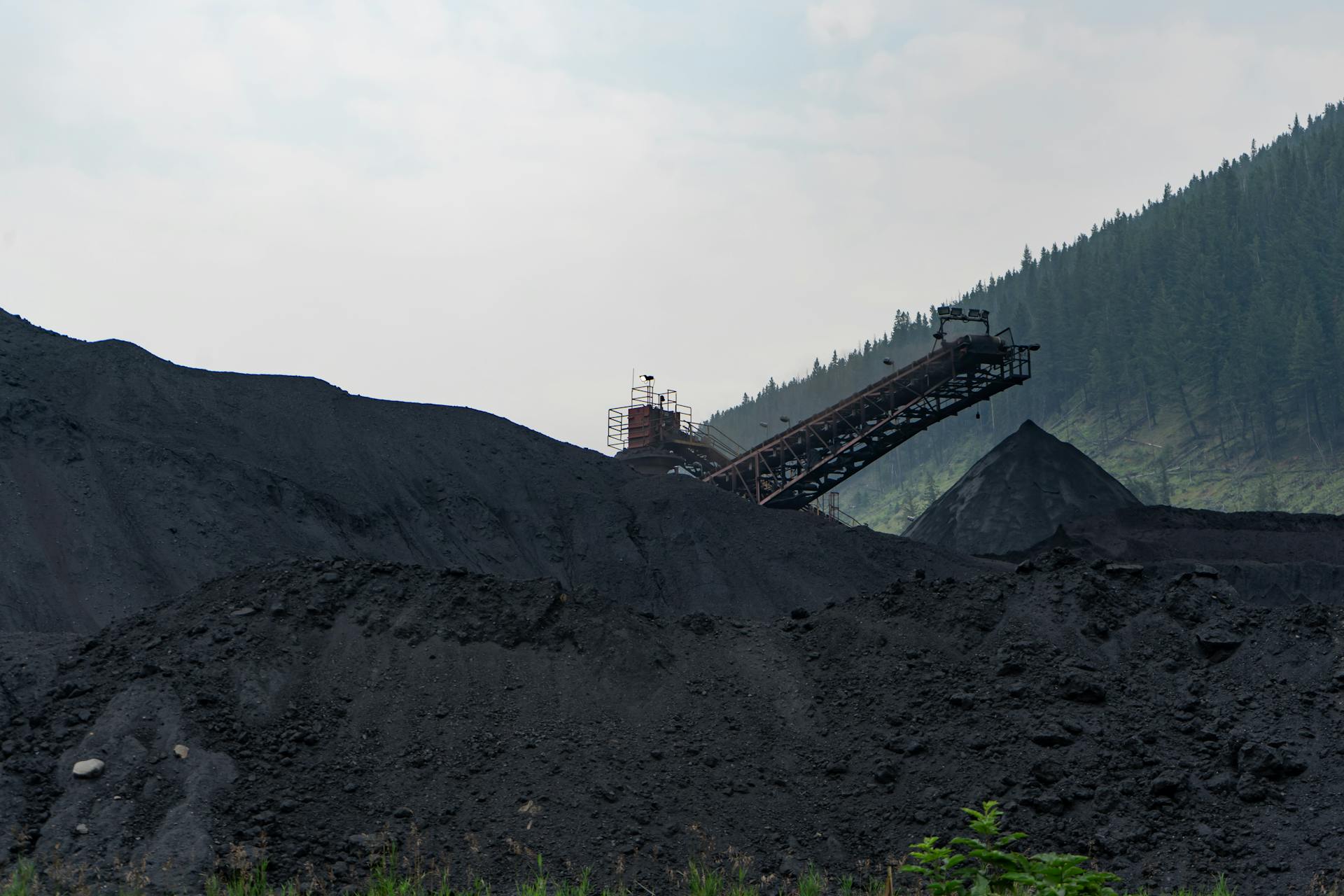 Industrial coal processing facility in Elkford, Canada with large coal piles.