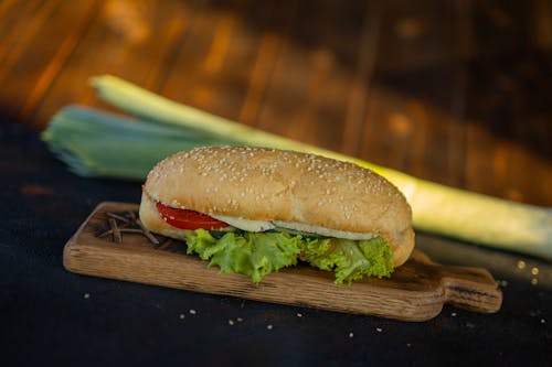 Burger on Brown Wooden Chopping Board