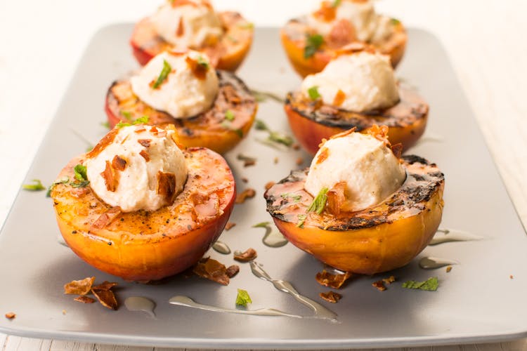 Peaches With Ice Cream On A Plate 