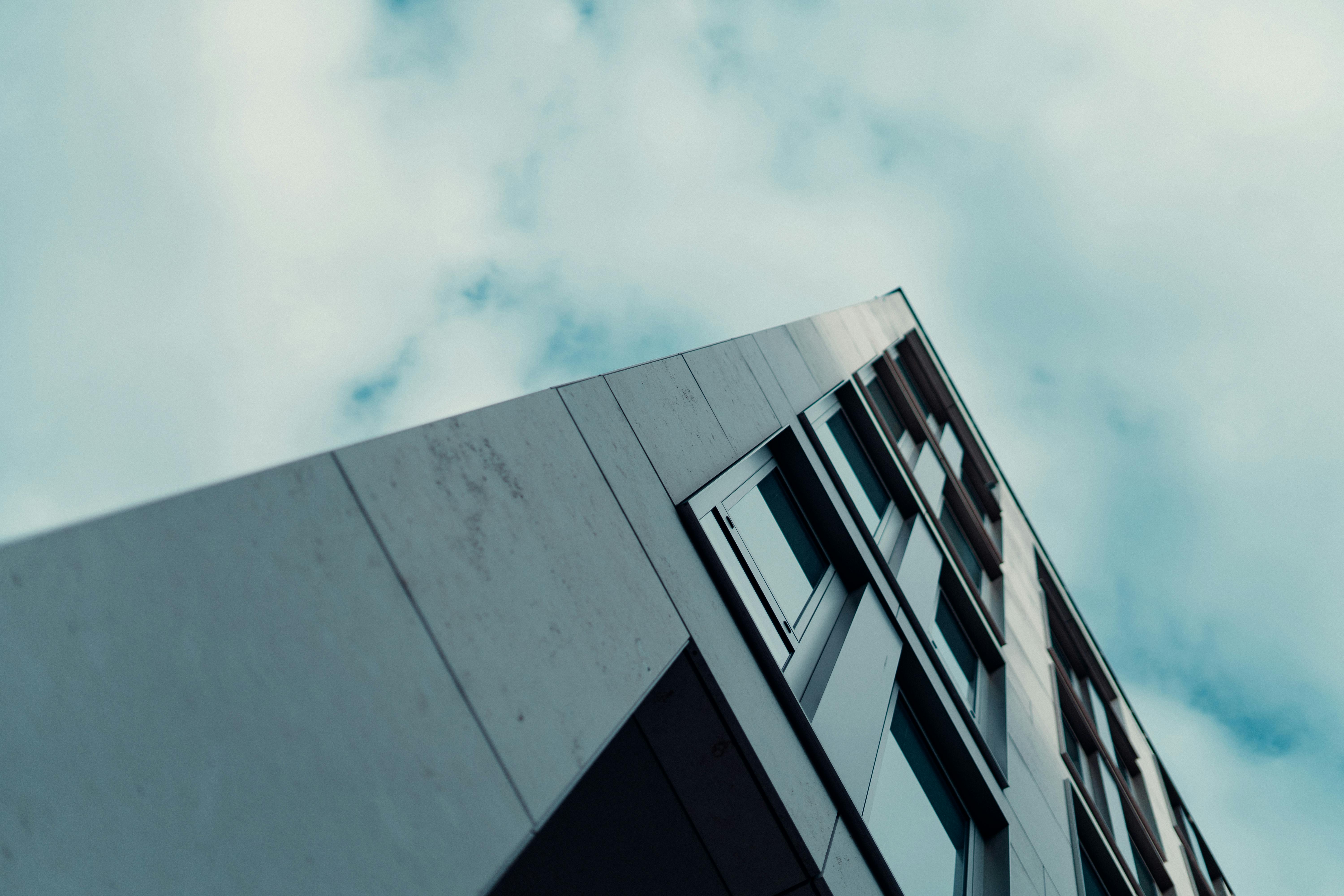 Free Low angle view of a modern building against a cloudy sky in Wiesbaden, Germany, showcasing urban architecture. Stock Photo