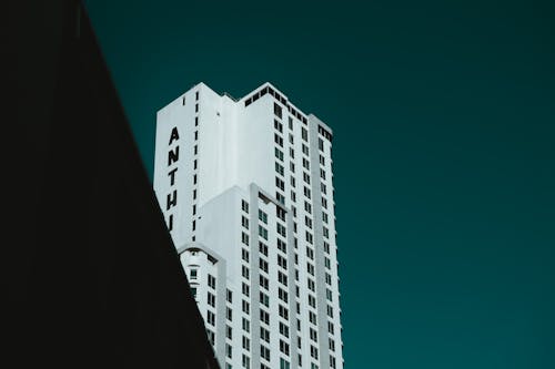 White Concrete Building Under Blue Sky