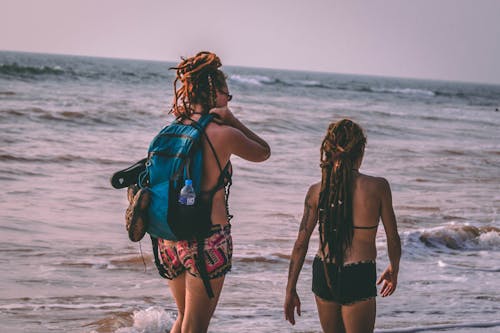 Free Two Woman Wearing Bikini Beside Seashore Stock Photo