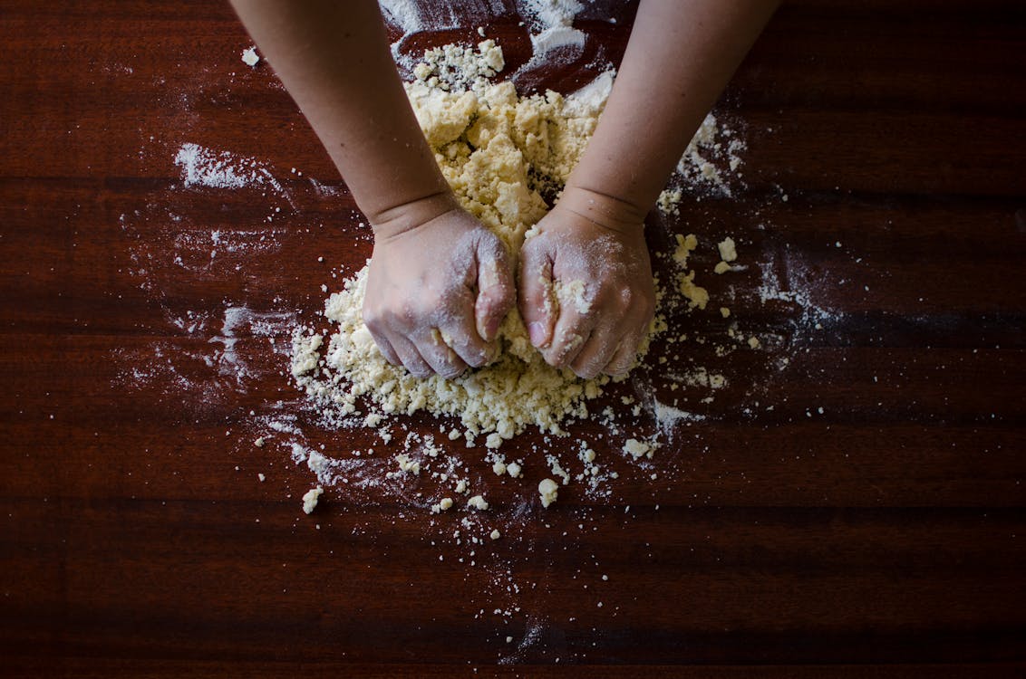 Person Mixing Dough