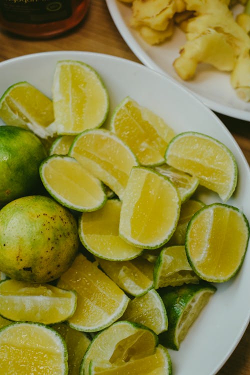 Sliced Lemon on White Ceramic Plate