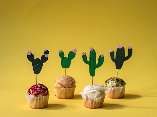 Free Cupcakes With Black and Green Cacti Design Stock Photo