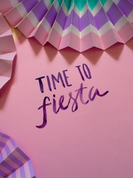 Vibrant paper decoration with 'Time to Fiesta' text for festive occasions.