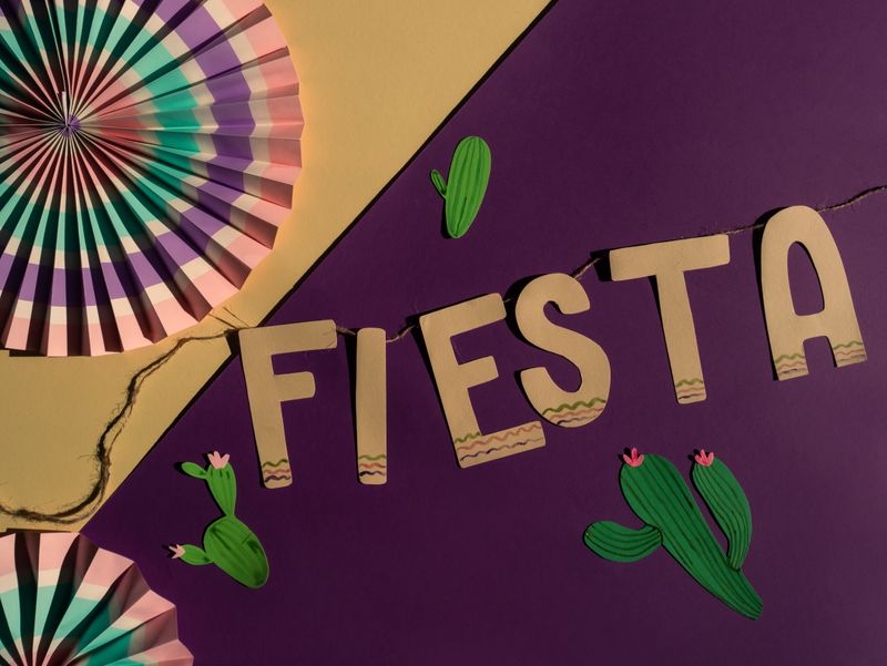 Colourful papel picado paper cutout decorations strung as festive banners
