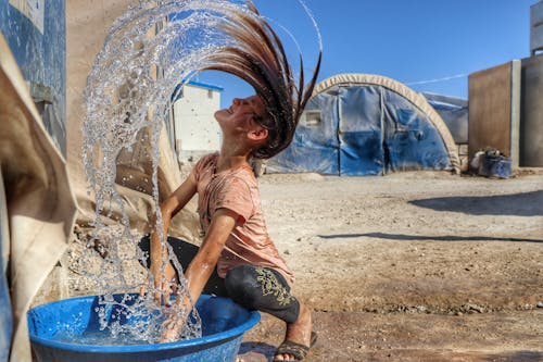 Gratis stockfoto met h2o, haar naar achteren, jong