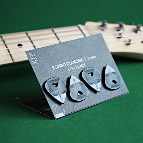 Free Guitar Picks on a Cardboard Stock Photo