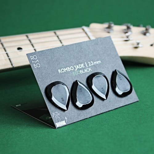 Close-Up Photo of a Guitar Pick Set Rombo Jade