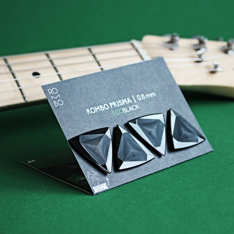 
Black Guitar Picks On A Card