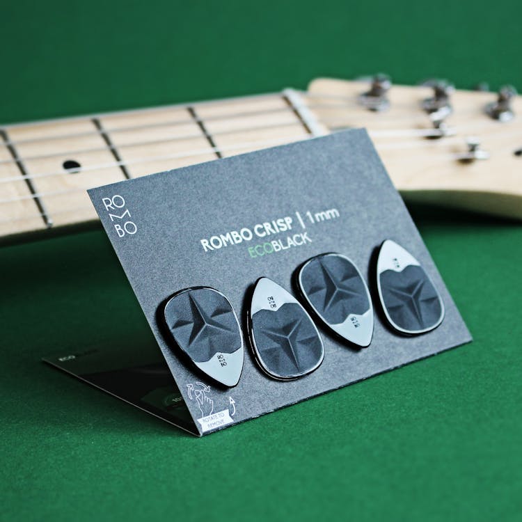 
Black Guitar Picks On A Card