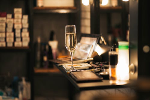 Free Close-Up Shot of Champagne Glass on Table Stock Photo