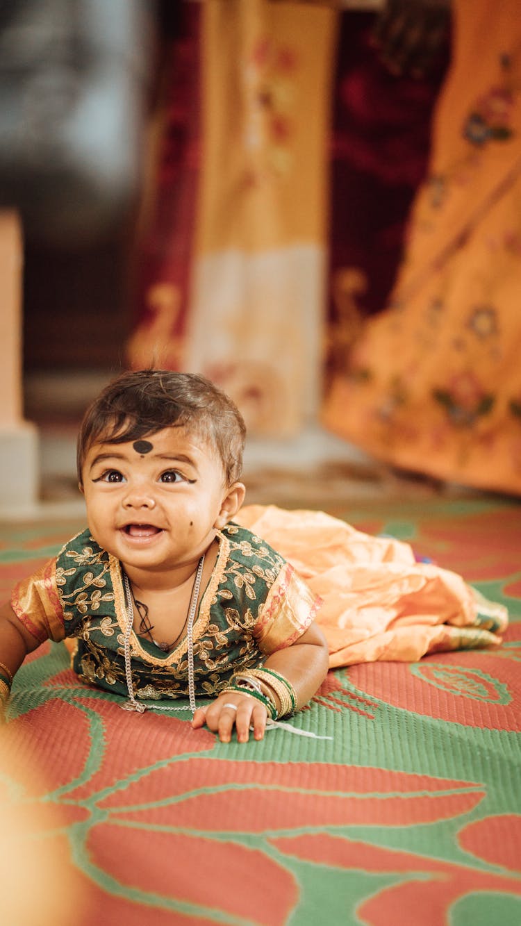 Cute Baby Lying On The Floor