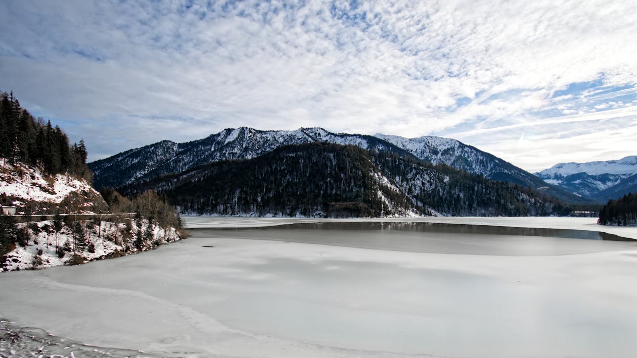 Snow Mountain With White Cloudy Sky