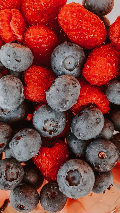 Free Close-Up Shot of Blueberries and Raspberries Stock Photo