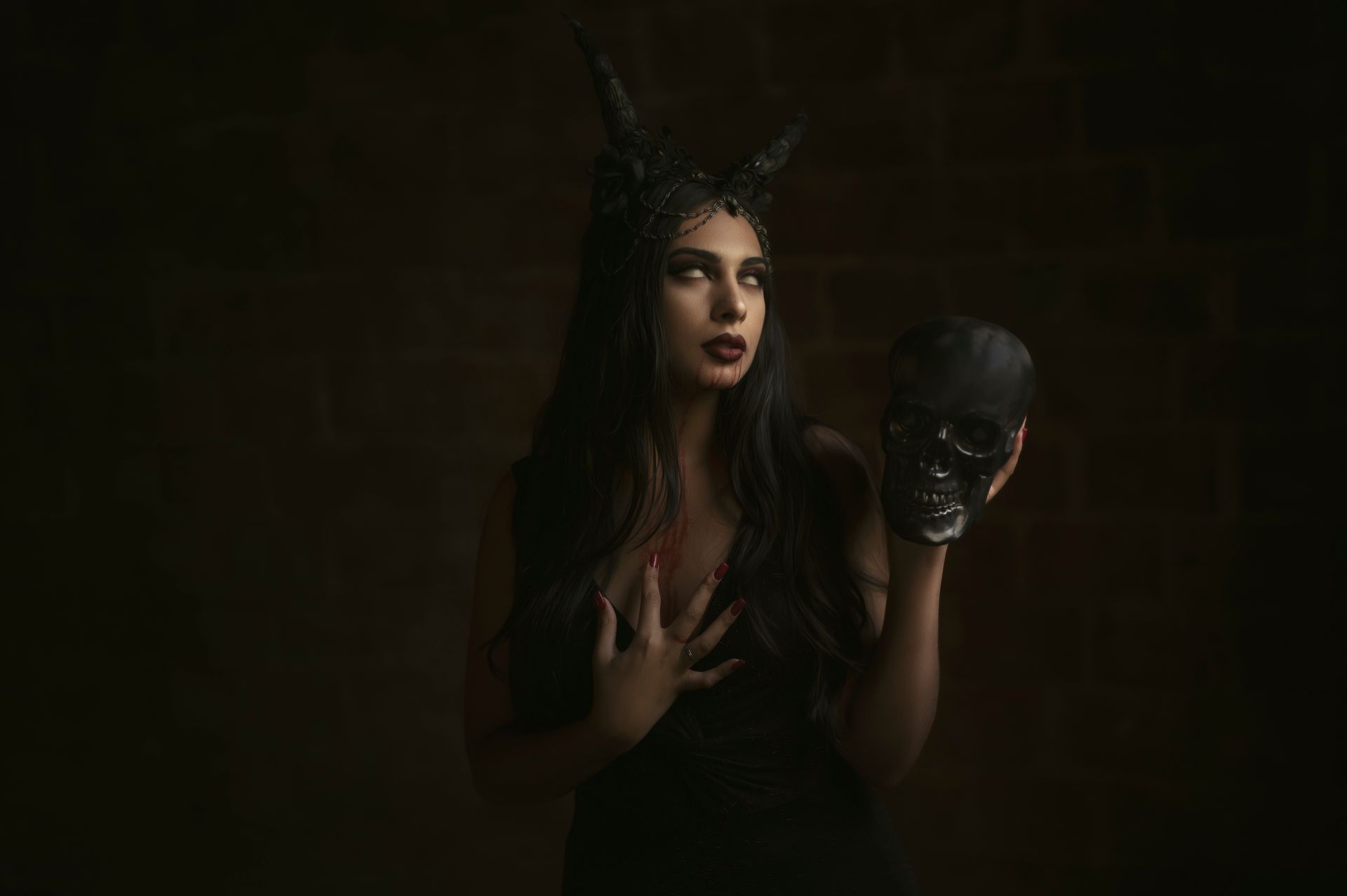 A Woman Holding a Skull
